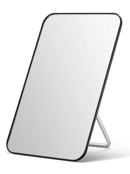 Rectangular mirror with black frame on a white background