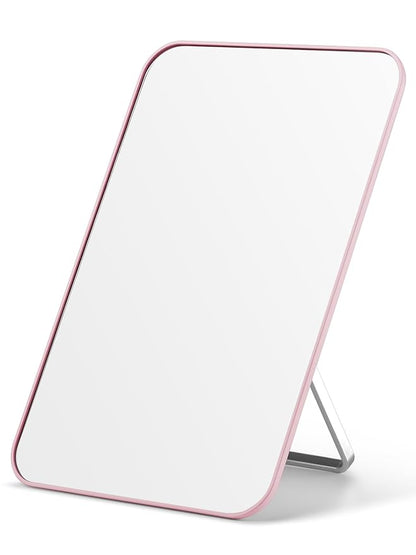 Rectangular mirror with a pink frame on a white background